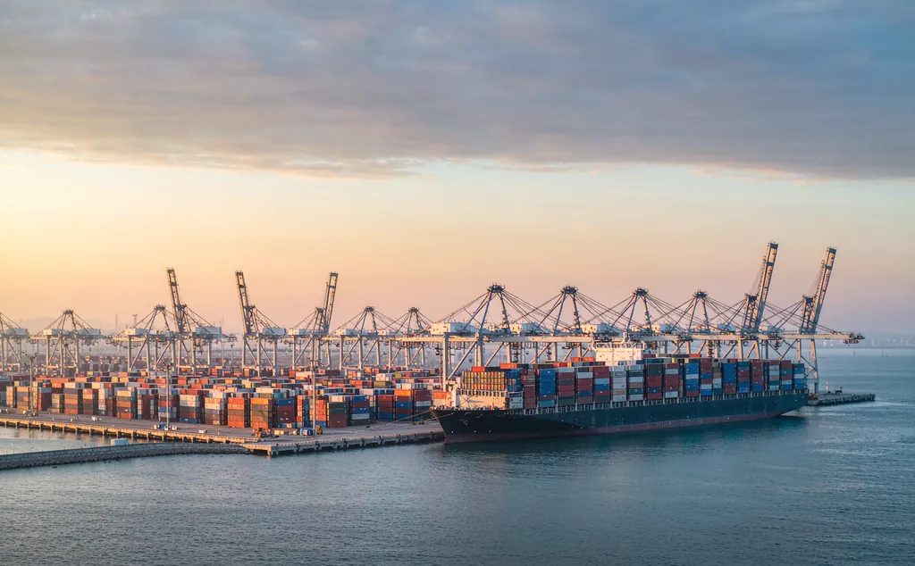 Container ship at a modern Chinese export terminal at daw